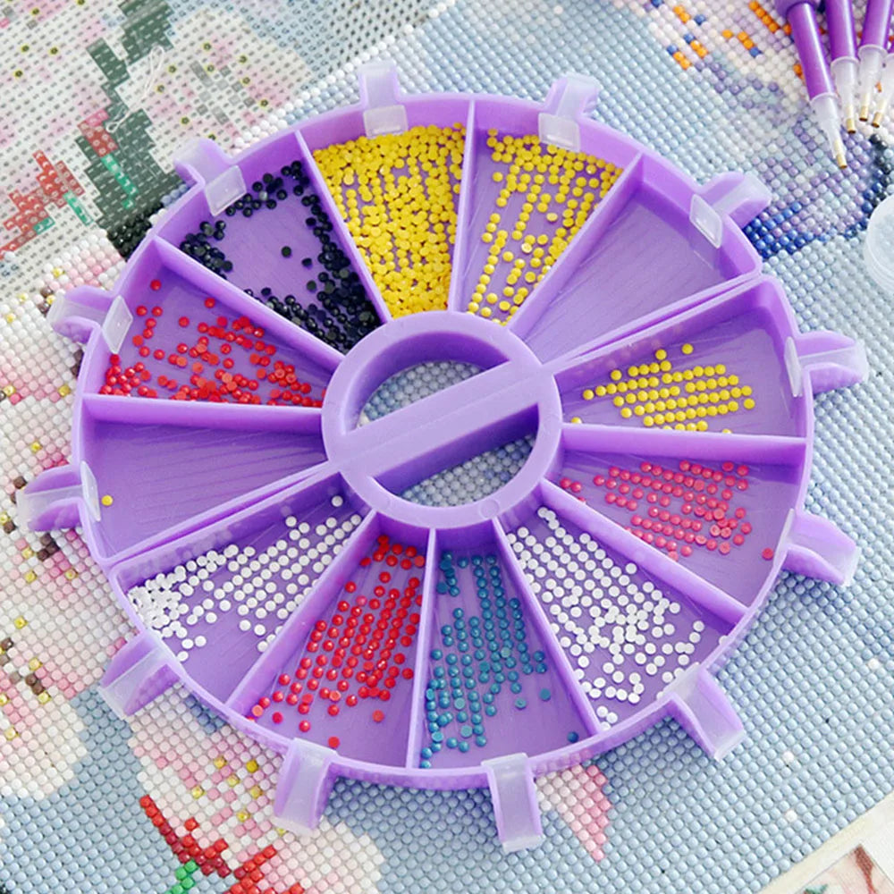 A purple 6-compartment diamond painting organizer tray filled with colorful sequins and beads.