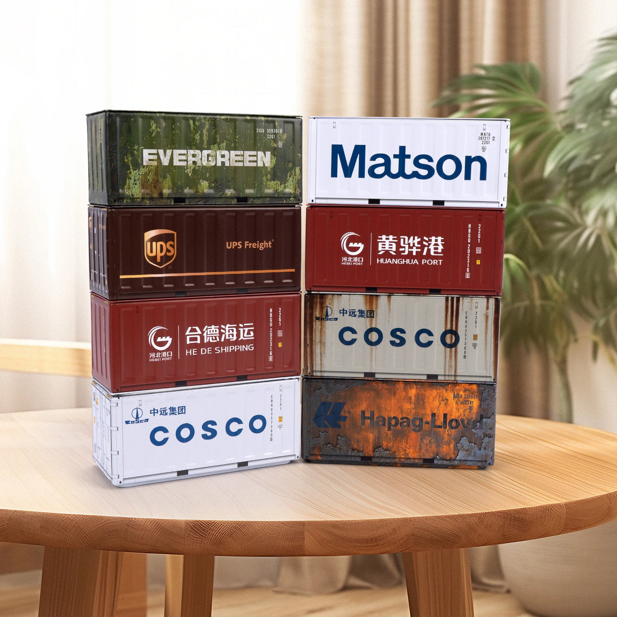 A collection of stacked brown and white industrial iron storage boxes labeled with various company names like Evergreen, Mats