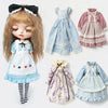 A doll wearing a blue lace maid dress set with pink and white accents, featuring ruffled sleeves and a tiered skirt.