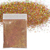 A small plastic bag filled with holographic fine glitter powder scattered across the surface.