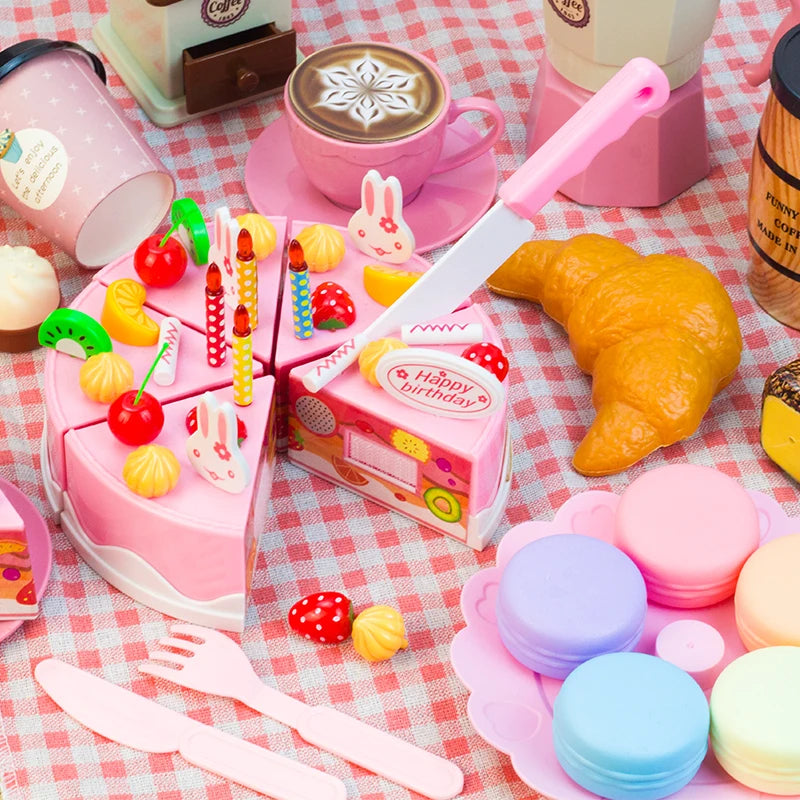 A pink pretend play tea party set featuring coffee cups, cakes, and various food items on a checkered tablecloth.