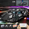 A detailed 1:14 scale black RC sports car model kit with components and a remote control transmitter shown alongside the fini