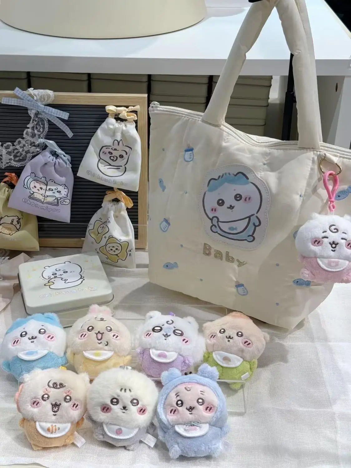 A collection of kawaii plush keychains featuring characters like Usagi, Hachiware, and JiYi.