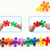 A collection of colorful, translucent building blocks in various colors like red, green, yellow, purple, and orange.