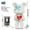 A detailed brick art bear figure made of light gray and white blocks, packaged with instructions.