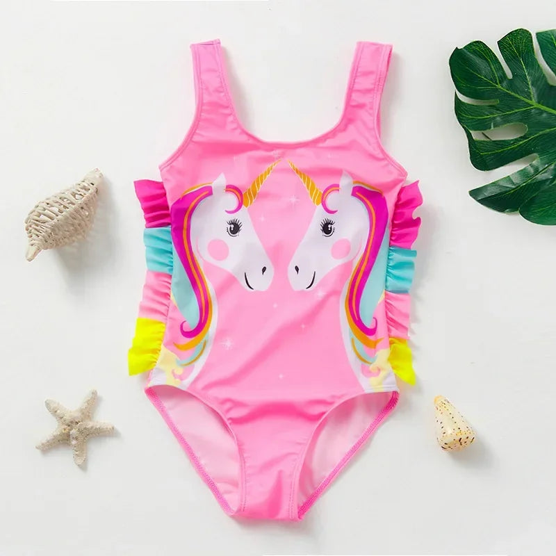 Pink one-piece swimsuit for a child featuring a unicorn design with rainbow accents