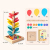 A wooden rainbow ball track toy featuring colored plastic balls and learning blocks for children.