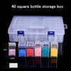 A transparent storage box with multiple compartments filled with colored beads and materials.