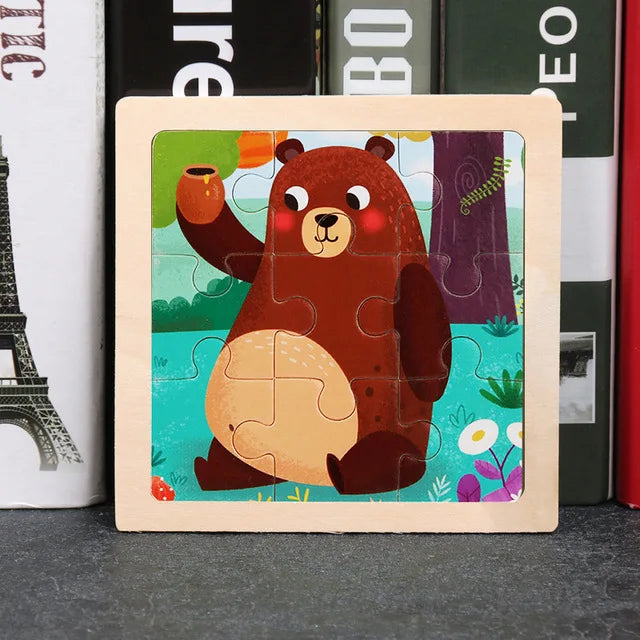 A wooden tangram puzzle featuring a cute brown bear surrounded by colorful nature elements.