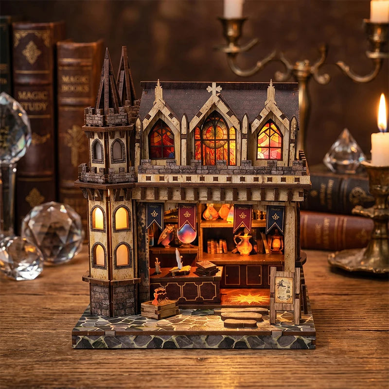A miniature kit of a wooden magic store cottage featuring detailed furniture and architecture.