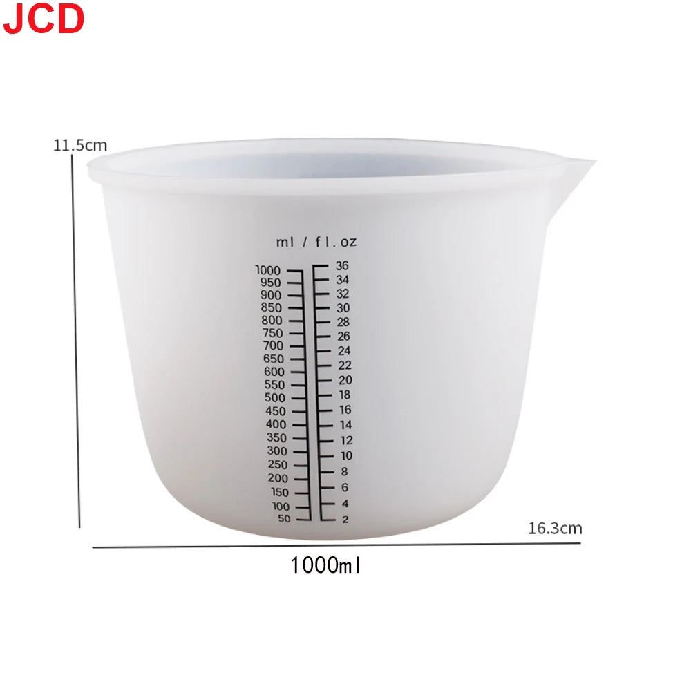 A white flexible silicone measuring cup with volume markings, shown from the side.