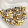 A pile of mixed color acrylic spacer beads in gold silver and clear tones for jewelry making