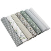 A pack of seven cotton fabric squares in various patterns including floral, polka dot, and striped designs.