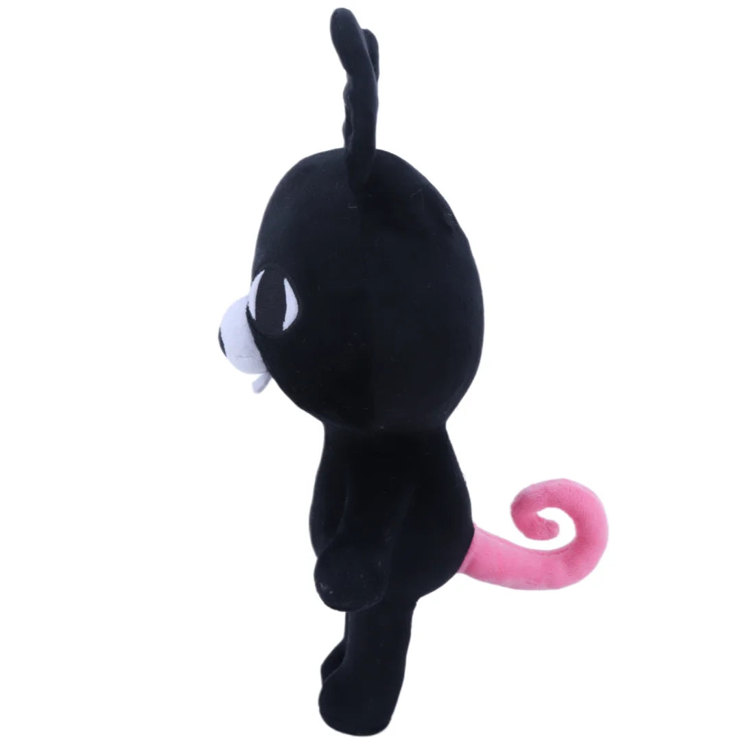 A black plush stuffed animal resembling a bunny with white accents and a pink curled tail.