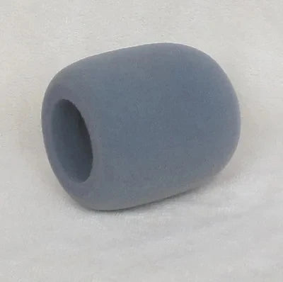 A smooth, oval-shaped grey foam windscreen or pop filter cover for a microphone.