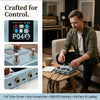 A man is demonstrating a portable multi-effects pedal with dual footswitches and USB/OTG interface on a wooden table.