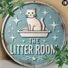 A rustic metal sign featuring a white cat sitting in a litter box surrounded by stars and the text The Litter Room