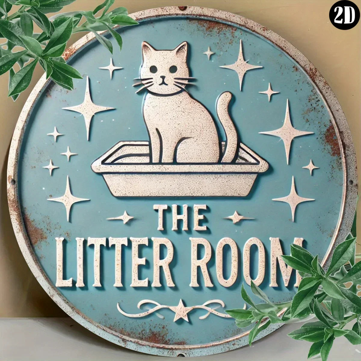 A rustic metal sign featuring a white cat sitting in a litter box surrounded by stars and the text The Litter Room