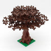 A model of a cherry blossom tree built from brown LEGO-style bricks, mounted on a green base.