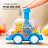 A blue transparent car toy with a blue plunger mechanism is shown being pressed and slid forward.