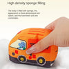 An orange fabric car toy with a map game mat is being held by a hand, showing its soft texture.