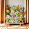 A display of mixed flower bouquets featuring roses, sunflowers, and various colorful blooms in potted arrangements.