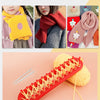 A red knitting loom with crochet hooks and yarn is shown next to knitted scarves and hats.
