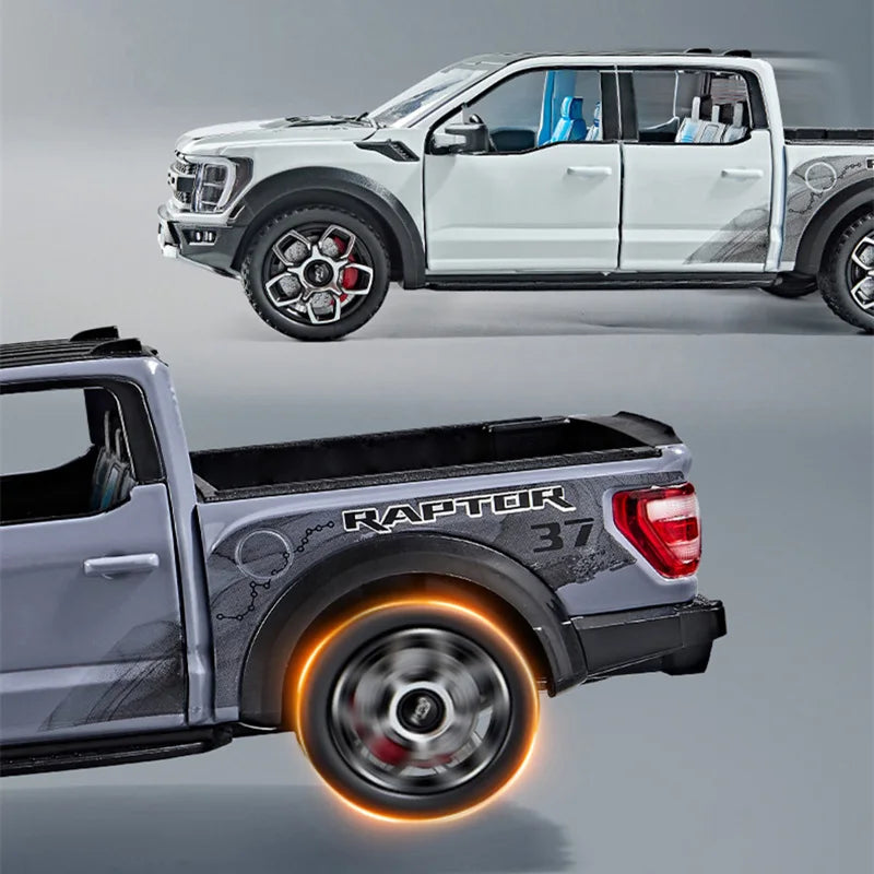 A silver Ford Raptor F150 diecast model truck with an illuminated rear wheel and light effects.