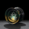 A close-up view of a professional aluminum alloy yo-yo with a dark green and gold finish.