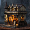 A detailed wooden miniature kit of a magic store cottage with furniture and stained glass windows.