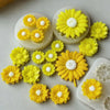 Yellow silicone molds shaped like sunflowers for candle making and soap crafting