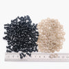 A collection of black and beige plastic safety eyes for amigurumi, displayed next to a ruler.