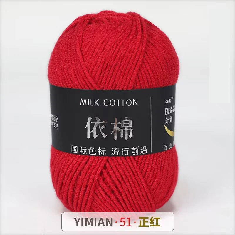 A ball of red milk cotton yarn labeled with Chinese characters and a YIMIAN brand mark.