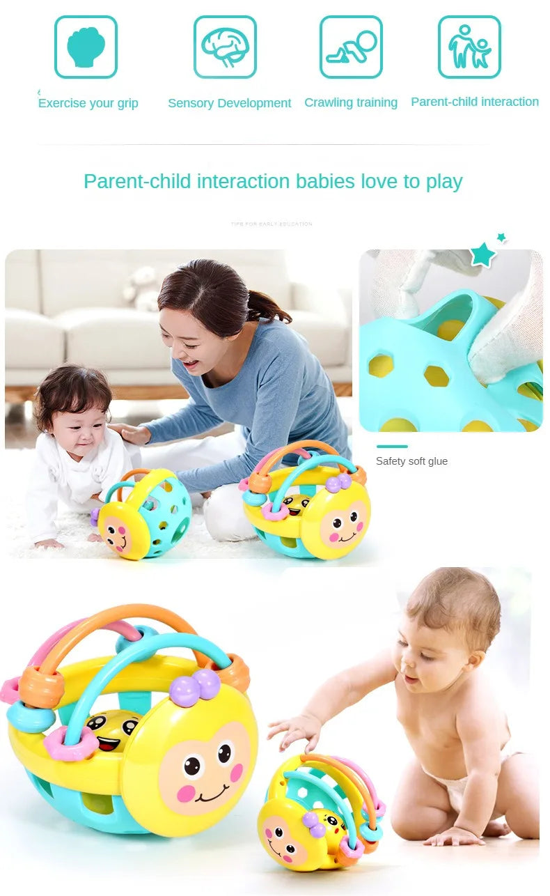 A baby is playing with a yellow and green sensory catch ball rattle toy designed for infants.