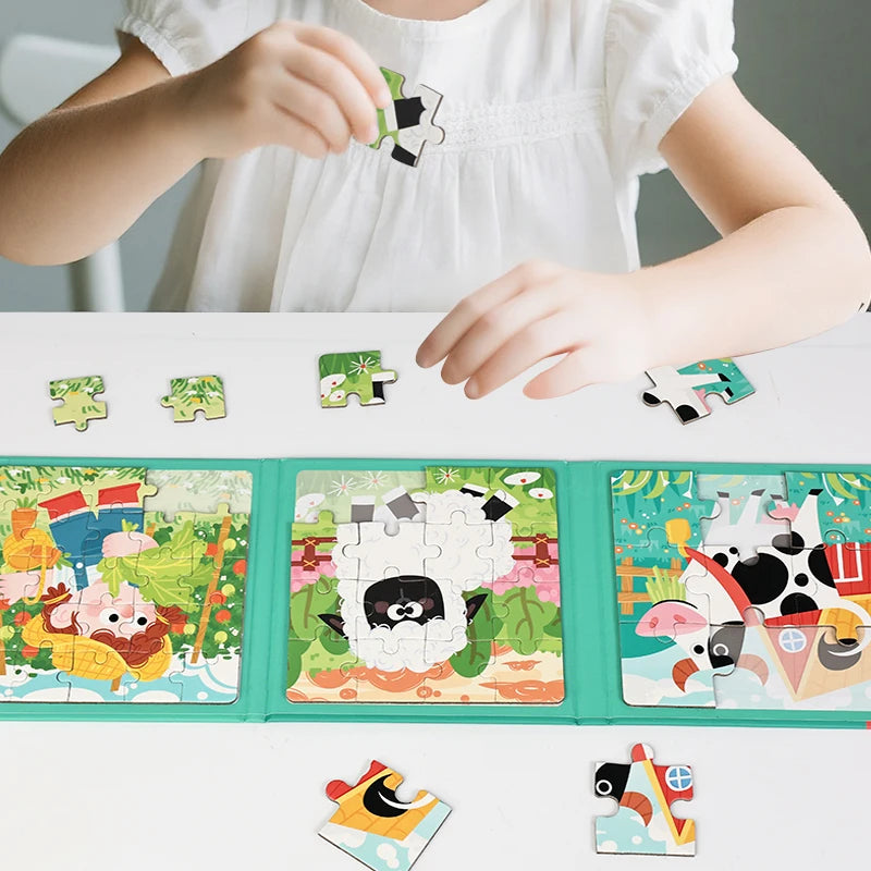 A child is assembling a magnetic jigsaw puzzle featuring animals, fruit, and traffic elements on a white table.
