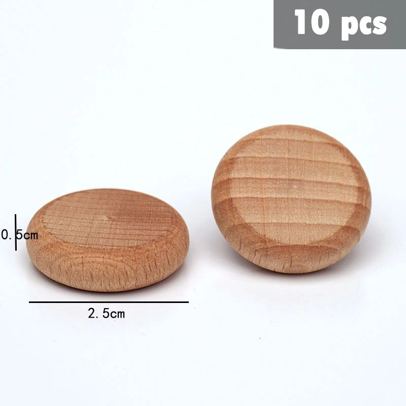 Ten natural wooden rainbow building blocks with visible grain texture and light brown color.