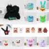 A collection of colorful, fuzzy monster plush toys and alien dolls in various colors like blue, green, purple, and orange.