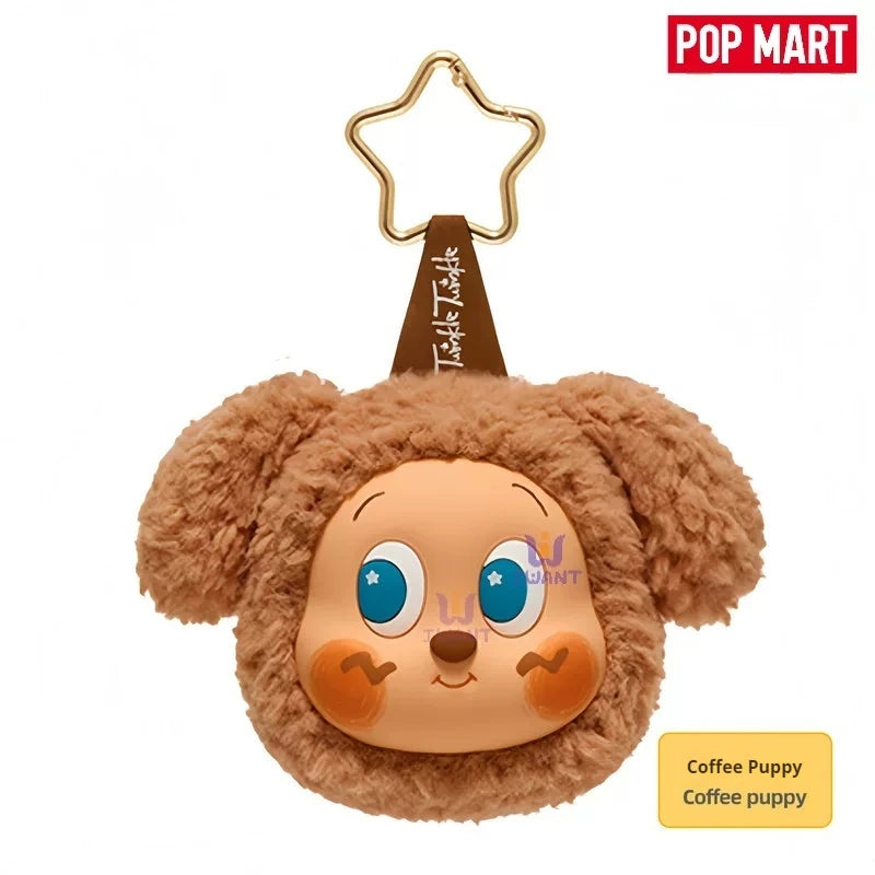 A fluffy brown teddy bear shaped earbud case cover with large eyes and a gold hanger.