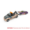 A die-cast metal container trailer truck set with pull-back action featuring a black and tan cab and a purple pickup truck.