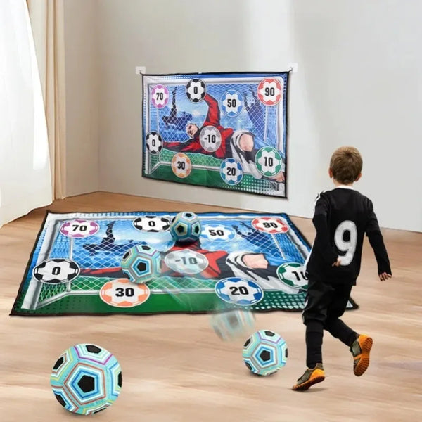 A soccer game mat set with a ball and a player figure is displayed on a wooden floor.