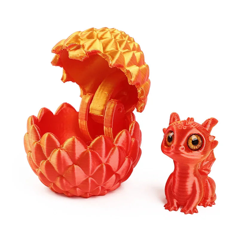 A bright orange, textured figurine of a dragon egg with an open shell and a small dragon figure beside it.
