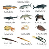 A set of mini ocean animal figurines including a whale, shark, dolphin, turtle, and penguin.