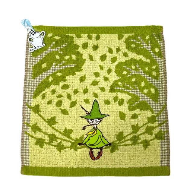 A soft green embroidered patch featuring a cartoon hippo character and foliage.