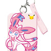 A pink display card set featuring Greninja and Sylveon characters on a keychain.