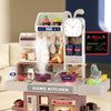 A children's play kitchen set featuring a home kitchen area with various food items and cooking tools.