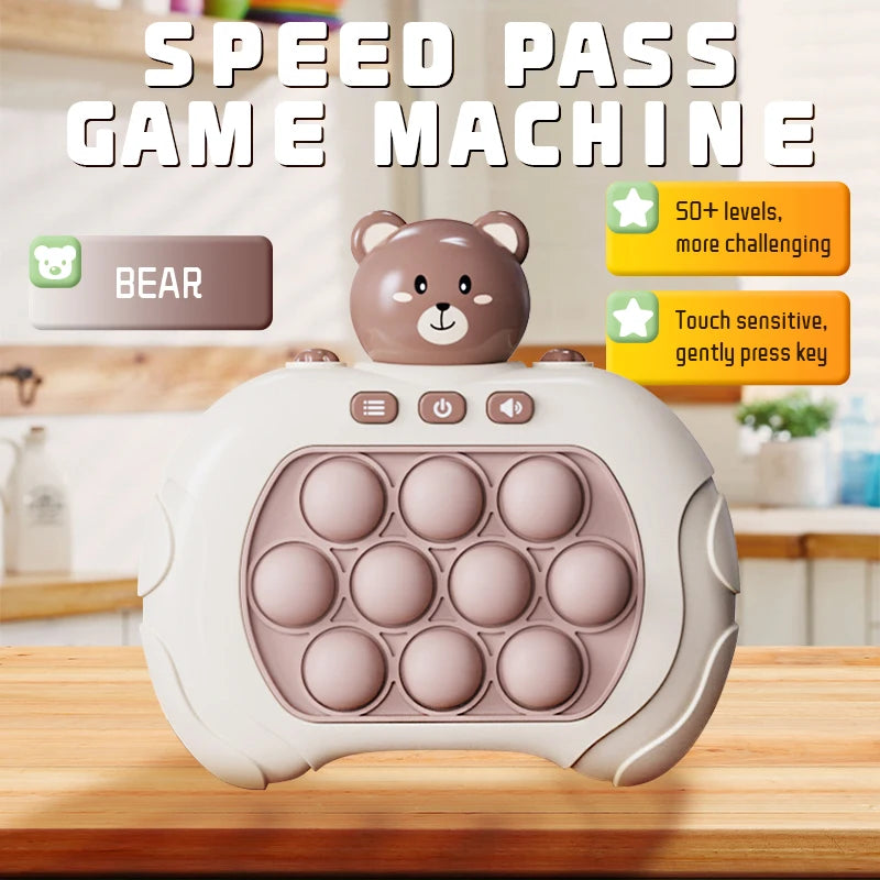 A beige bear-shaped Pop It game machine with a silicone fidget surface is displayed on a wooden table.