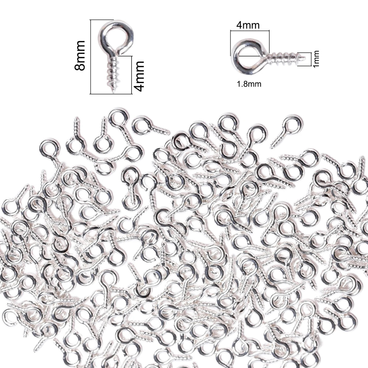 A pile of small silver metal eye pins used for jewelry making and DIY crafts.