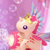 A hand holds a pink unicorn toy gun that shoots colorful lights and bubbles against a purple background.