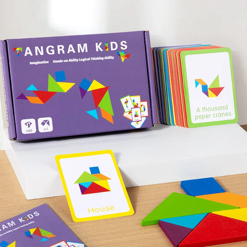 A box of Angram Kids wooden tangram puzzles and individual puzzle pieces for shape learning.