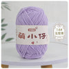 A ball of light purple chenille yarn labeled with Chinese characters for knitting and crochet.